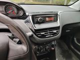 a dashboard of a car with a steering wheel and dashboard controls