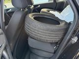 a car that has a tire in the back of it