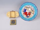 a plate with a picture on it next to a small plate with a picture on it