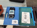 a box with a cell phone inside of it on a table