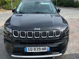 the front of a black jeep compass parked in a parking lot