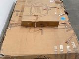 a cardboard box sitting on top of a carton on the floor