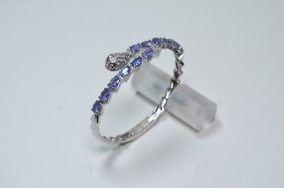 a picture of a ring with blue and white diamonds