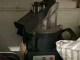 a blender sitting on top of a kitchen counter next to a sink