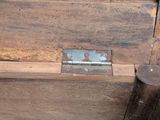 a close up of a piece of wood with a latch on it