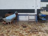 a room with a table, chairs, and a chair in it