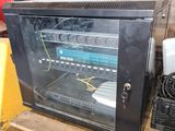 a black cabinet with a bunch of wires in it