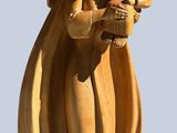 a statue of a woman holding a baby in her arms