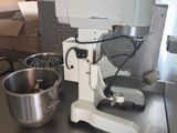 an image of a kitchen counter with a mixer and a bowl