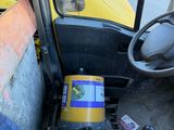 a yellow truck with a yellow box in the back of it