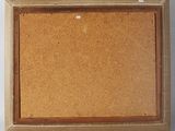 an old picture frame with a cork board attached to it