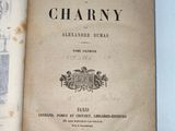 an old book that is open on a table