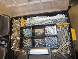 many different types of screws and nails in a toolbox