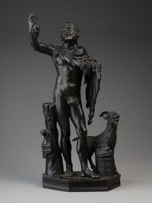 statue en bronze représentant un homme tenant un chien et un oiseau dans la main