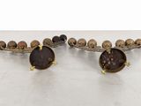pair of brass plated wall sconces with shells on them