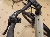 a close up of a bicycle handlebar with a cell phone on it