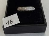 a ring in a box with a price tag on it