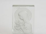 a glass block with a picture of a woman holding a flower
