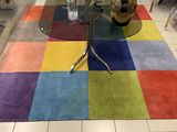 a colorful rug on the floor in a room