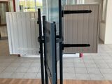 a metal pole with a sign on it in a building
