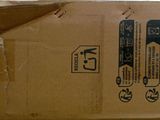 a cardboard box that has some stickers on it