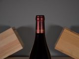 a bottle of wine that is sitting on a table