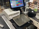 an image of a cash register machine in a store