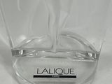 an image of a clear glass vase with a black label on it