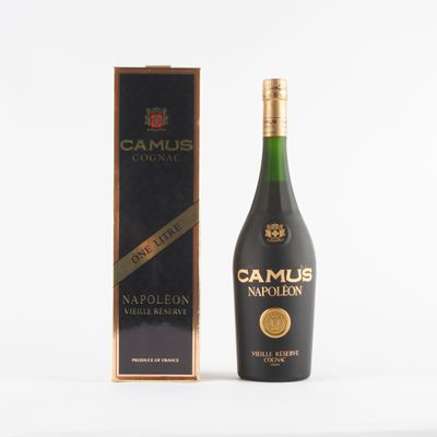 a bottle of camus marmelon next to a cardboard box