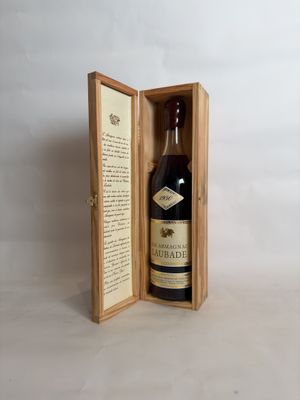 an open wooden box with a bottle of liquor inside of it