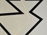 a black and white picture of a zigzag sign