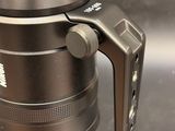 a close up of a camera with a lens attached to it