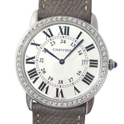 a close up of a wrist watch with roman numerals on the face