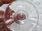 a person holding a wine glass in their hand