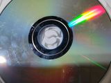 a picture of a cd with a rainbow light on it