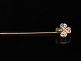 an image of a gold stick with a flower design on it