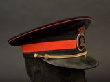 an image of a black hat with a red stripe on it