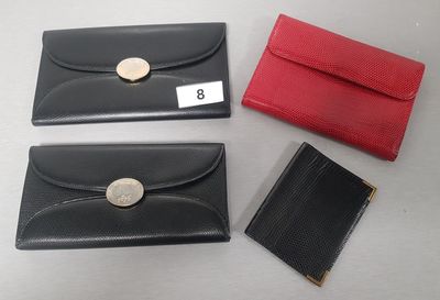 three black and red leather wallets and a red and black card case