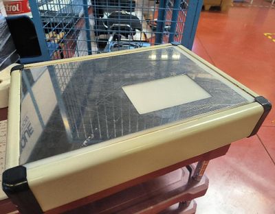 a table with a glass top on it in a store