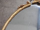a mirror that is sitting on the floor in the room