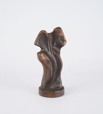 an image of a bronze sculpture of a woman ' s face
