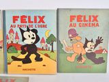 three books of felix the cat and felix the clown are on display