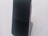 a cell phone that is sitting on top of a stand