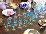 a table with many glasses and plates on it