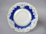 an image of a blue and white plate with gold trim