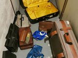 many pieces of luggage sitting on the floor next to each other