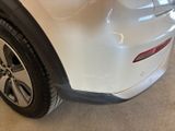 a close up of a white car with black rims
