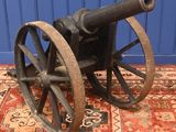 an old cannon sitting on top of a rug