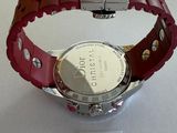 a watch that is sitting on a white table