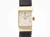 a close up of a wrist watch on a white background